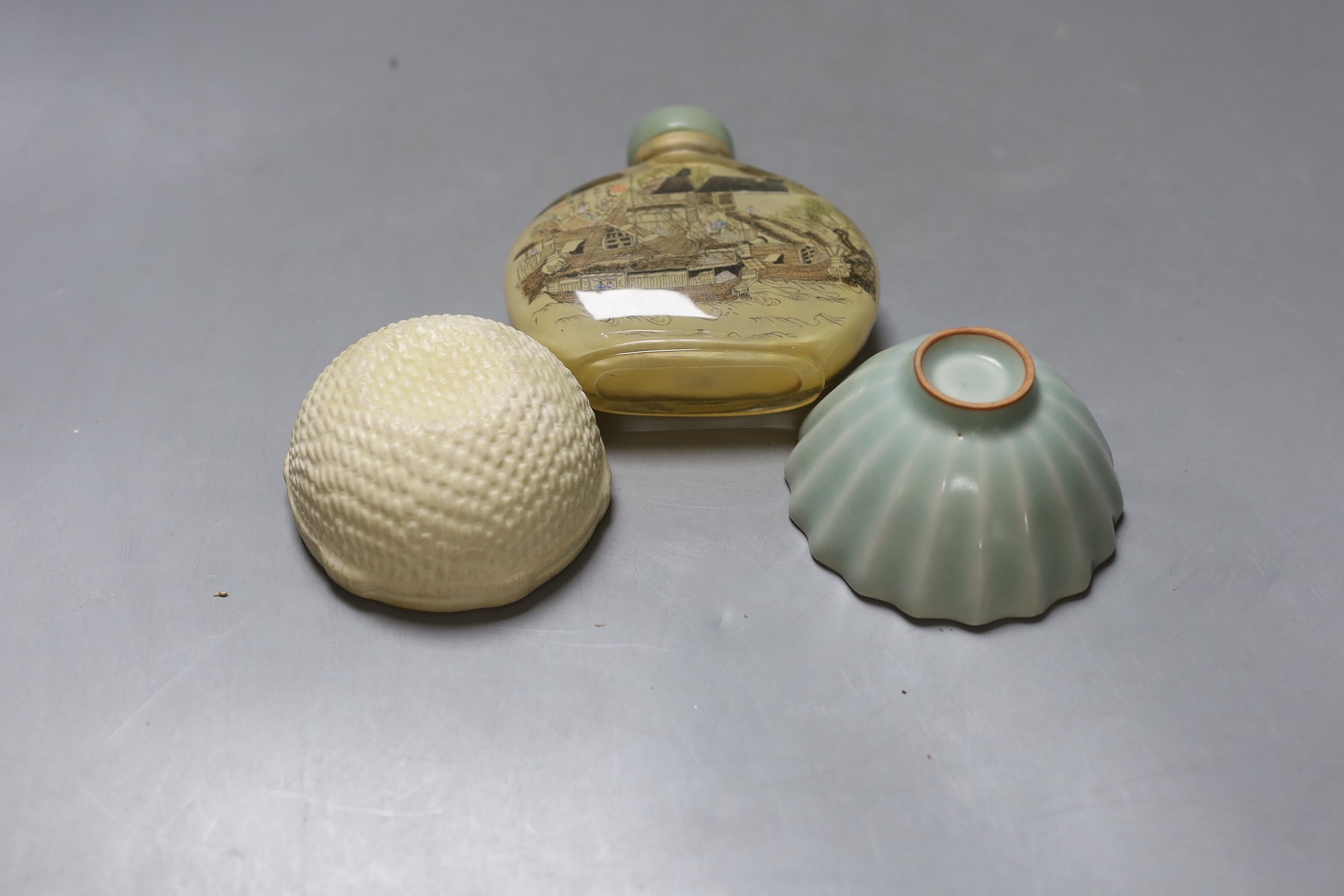 A Chinese inside-painted glass snuff bottle and cover, 10cm high, a Chinese Ming type basketware cup and a Chinese celadon fluted cup